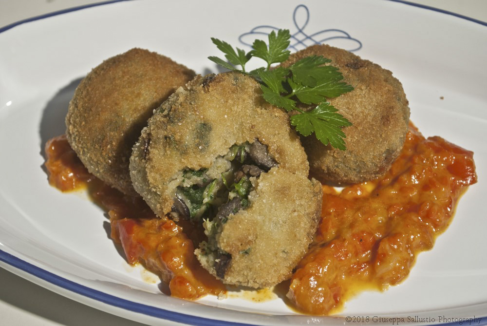 A warm, soft heart of mushrooms, Swiss chard and pecorino cheese dipped in a sweet pepper sauce